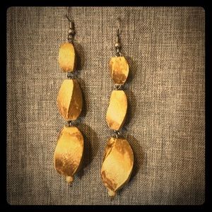 Wooden earrings with gold paint.